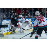 Kelowna Rockets Defenceman Gordie Ballhorn crushes and opponent while Liam Kindree looks on
