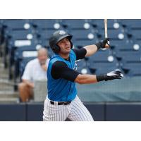 Angel Aguilar of the Tampa Tarpons watches the ball sail