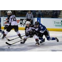 Vancouver Giants RW Jared Dmytriw holds off the Victoria Royals