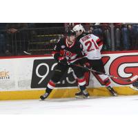 Binghamton Devils center Kevin Rooney (right) battles against the Belleville Senators