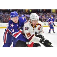 Cleveland Monsters center Zac Dalpe (right) and the Rochester Americans battle