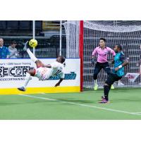 St. Louis Ambush keep an eye on a bicycle kick by Leo Gibson of the Kansas City Comets