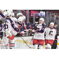 Cleveland Monsters center Alex Broadhurst (25) high fives the bench