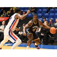 Saint John Riptide guard Kemy Osse (right)