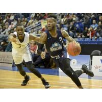 Halifax Hurricanes guard Joel Kindred drives around a Saint John Riptide defender