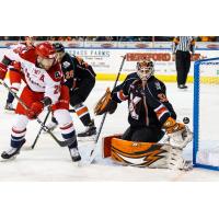 Allen Americans center Spencer Asuchak slips one by the Kansas City Mavericks goaltender