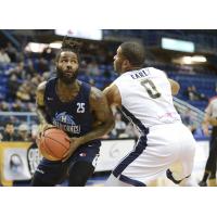 Halifax Hurricanes forward Gabe Freeman (left) eyes the hoop vs. the Saint John Riptide