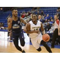 Halifax Hurricanes guard Joel Kindred (left) defends against the Saint John Riptide