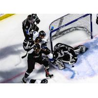 Utah Grizzlies goaltender Kevin Carr eyes a loose puck against the Wichita Thunder