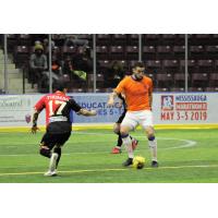 Mississauga MetroStars' Matthew Rios (Orange) in action vs. the Baltimore Blast