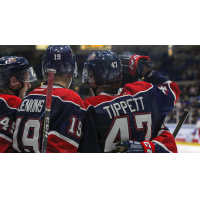 Owen Tippett of the Saginaw Spirit receives congratulations from his new teammates