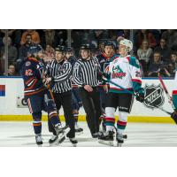 Kelowna Rockets LW Nolan Foote (right) greets a member of the Kamloops Blazers