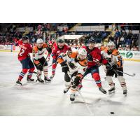 Lehigh Valley Phantoms defenseman T.J. Brennan emerges from a crowd with the puck