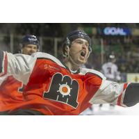 Maine Mariners celebrate a goal in their throwback uniforms