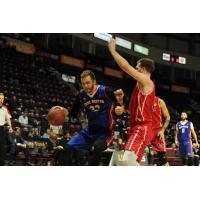 Cape Breton Highlanders center Tanner Giddings (left) against the Windsor Express