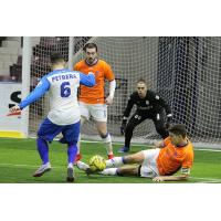 Mississauga MetroStars' Adrian Cann and Marco Rodriguez defend their goal against Utica City FC