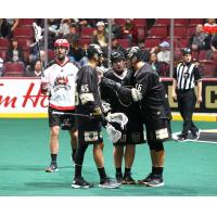 Vancouver Warriors huddle against the Calgary Roughnecks