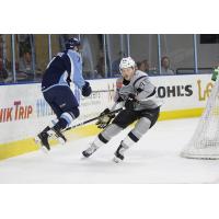 Ryan Olsen of the San Antonio Rampage (45) forechecks Milwaukee Admirals defenseman Scott Savage