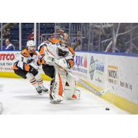 Lehigh Valley Phantoms goaltender Carter Hart handles a puck behind the net