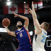 Halifax Hurricanes centre Chad Posthumus defends vs. the Cape Breton Highlanders