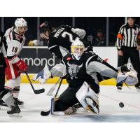 San Antonio Rampage goaltender Evan Fitzpatrick lunges for a save on Grand Rapids Griffins forward Carter Camper