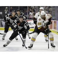 Joey LaLeggia of the San Antonio Rampage (left) chases down Chicago Wolves forward Keegan Kolesar