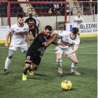 Jon Orlando of the Baltimore Blast tries to fight off the Harrisburg Heat