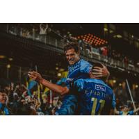 Salgado and Edson Partido celebrate the first win for El Paso Locomotive FC