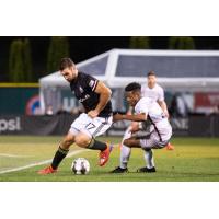 Tacoma Defiance forward Will Bruin (left) fights for possession against Sacramento Republic FC