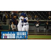 Tennessee Smokies exchange congratulations after scoring