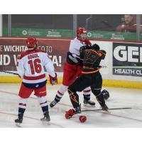 Josh Atkinson of the Allen Americans (white) fights with the Wichita Thunder