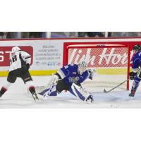 Davis Koch of the Vancouver Giants (left) scores against the Victoria Royals