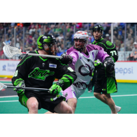 Saskatchewan Rush forward Ben McIntosh ignores a Colorado Mammoth stick in his face