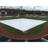 The tarp over the field at Smokies Stadium