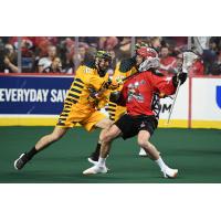 Alex Crepinsek of the Georgia Swarm defends against the Calgary Roughnecks