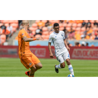 Marcos Lopez of the San Jose Earthquakes on the ball versus Houston Dynamo's Alijaz Struna