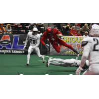 Jacksonville Sharks receiver Jarmon Fortson leaps over a New York Streets defender