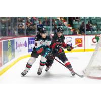Kelowna Rockets defenceman Cayde Augustine (right) battles the Prince George Cougars