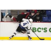 Vancouver Giants defenceman Bowen Byram is tossed into the boards by the Victoria Royals