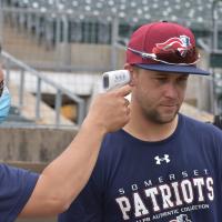 Scott Kelly of the Somerset Patriots gets his temperature taken