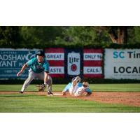 Tyler Finke of the St. Cloud Rox slides safely into second against the Rochester Honkers