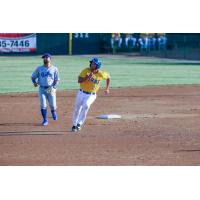 Damek Tomscha of the Sioux Falls Canaries rounds second against the St. Paul Saints