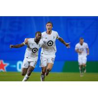 Minnesota United FC celebrates a late goal against Sporting Kansas City