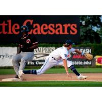 Jordan Barth of the St. Cloud Rox stretches to catch a ball against the Mankato MoonDogs