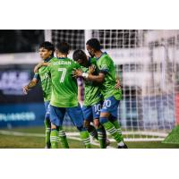 Seattle Sounders FC teammates celebrate with Nico Lodeiro