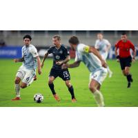 Louisville City FC midfielder Corben Bone (center) vs. Indy Eleven