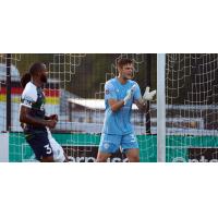 Louisville City FC goalkeeper Ben Lundt exhorts his team against Saint Louis FC