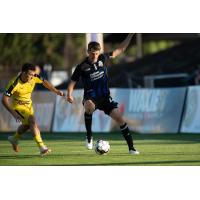 Colorado Springs Switchbacks FC right back Jordan Burt with possession against New Mexico United