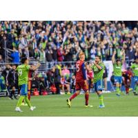 Nicolas Lodeiro and Raul Ruidiaz of Seattle Sounders FC celebrate last year's postseason win over Real Salt Lake at CenturyLink Field