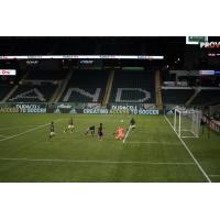 Raul Ruidiaz scores one of his two goals in Seattle Sounders FC's win over Portland on August 23 at Providence Park